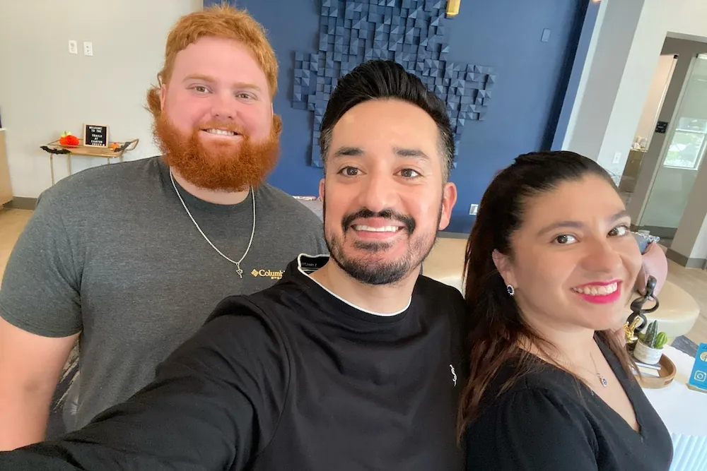 The friendly team at One Place Locators smiling together, demonstrating their passion and knowledge in "how to become an apartment locator."