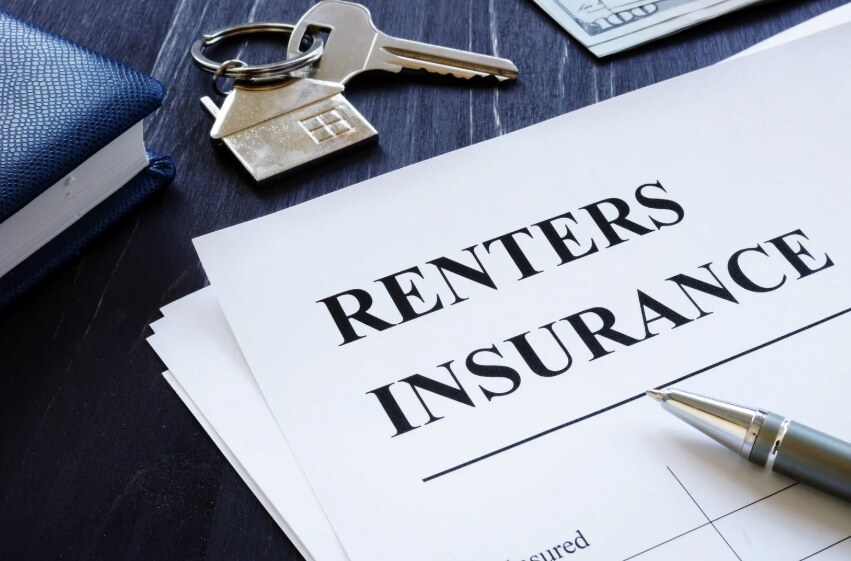 Renters insurance paperwork beside apartment keys
