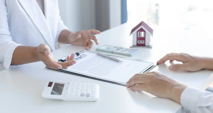 A renter reviewing a rental contract with a leasing professional